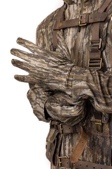 Model wearing Realtree Legacy lightweight hunting gloves with adjustable cuff