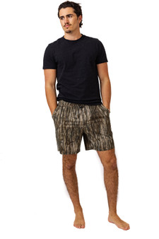 Front view of men’s camouflage shorts featuring side pockets and relaxed fit.
