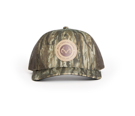 Front view of Realtree Legacy camouflage hat with circular logo patch and mesh back.
