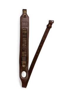 Full vertical view of the Wren & Ivy Realtree 40th Anniversary Shotgun Sling featuring brown leather and Realtree camo panel.