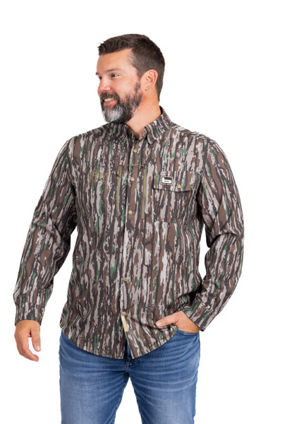Angled front view of Banded Men’s Badlander lightweight hunting shirt in Realtree Original camo.