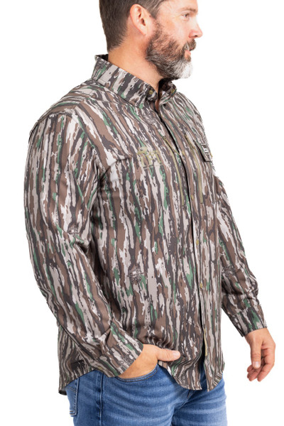Three-quarter view of Banded Men’s Badlander lightweight camo hunting shirt worn by model.