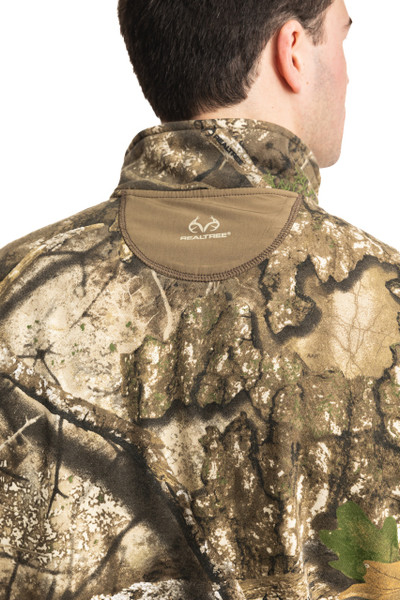 Close-up back collar detail of men’s Realtree APX fleece vest with logo patch.