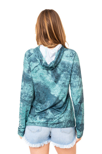 Back view of a woman wearing the Realtree Fishing Women’s XTREME Emerald Green Hooded Shirt, showing the relaxed fit and hood design.