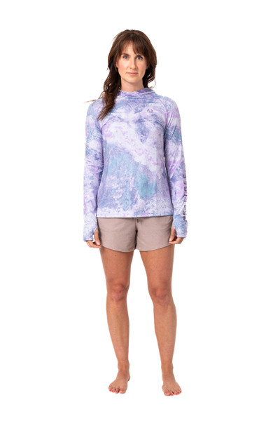 Long-sleeve women's hooded performance shirt in a lavender, rose, and blue marbled camo pattern, shown from the front main.