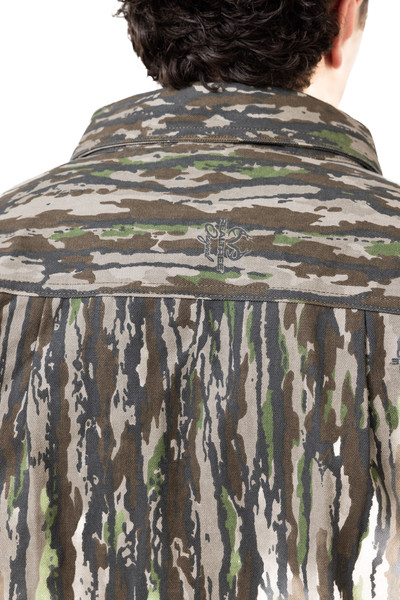 Close-up of back yoke and collar stitching with camo pattern detail.