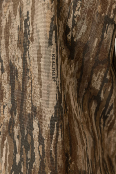 Close-up of the camo fabric on the men’s Realtree Legacy button-down shirt showing detail of the pattern and texture.