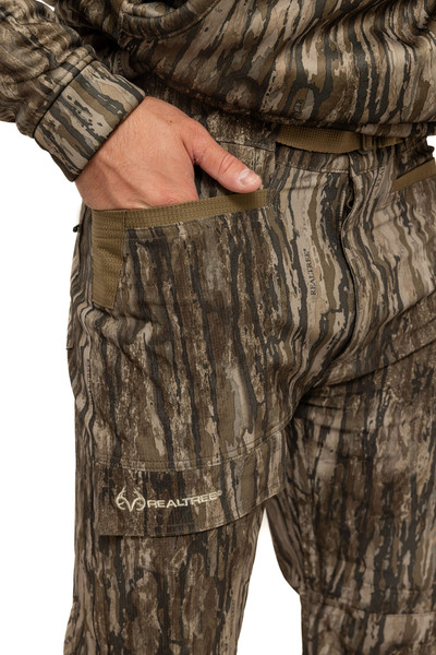 Close-up of the Men’s Stalker 5-Pocket Hunting Pants in Realtree Legacy showing reinforced front pockets and embroidered Realtree logo.