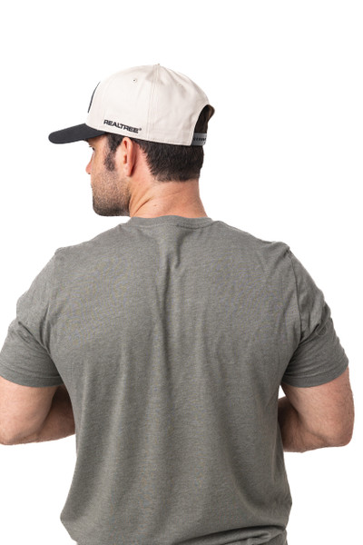 Back view of a man in a gray shirt wearing a white and black Realtree cap with side branding.