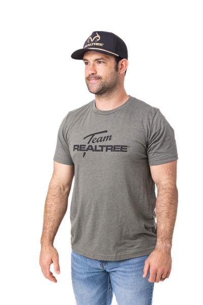 Man wearing the black Center Stage Realtree rope hat and a grey Team Realtree T-shirt, shown in a full front-angled view.