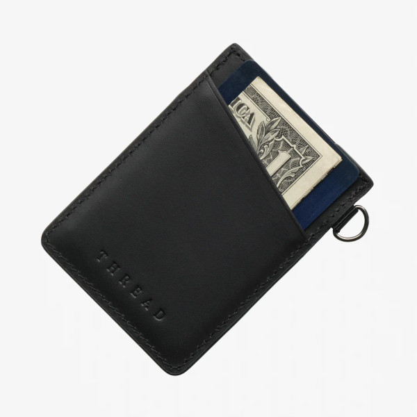 Back view of Thread vertical wallet with black leather exterior, card pocket, and key ring attachment.