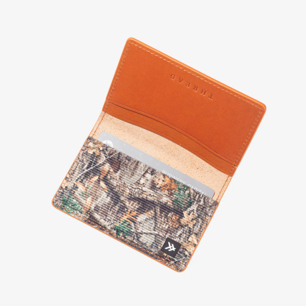 Thread camo bifold wallet in Realtree EDGE with interior card slots and orange leather exterior main.