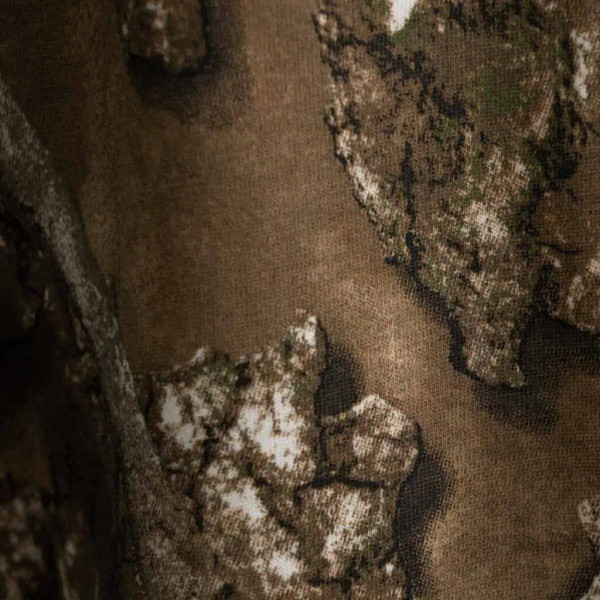 Close-up of Realtree camo fabric showing detailed bark and leaf pattern texture.