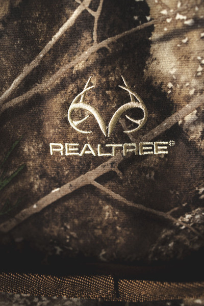 Close-up of embroidered Realtree logo on Realtree APX camo fabric.