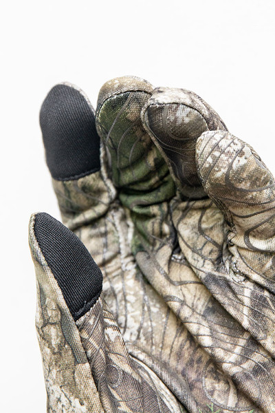 Close-up of touchscreen-compatible fingertips on Realtree APX hunting gloves