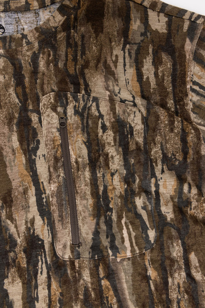 Close-up of zip chest pocket on Realtree Legacy bamboo camo shirt.