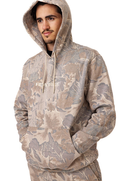 Hoodie worn with hood up, highlighting adjustable drawstrings and camo pattern detail.