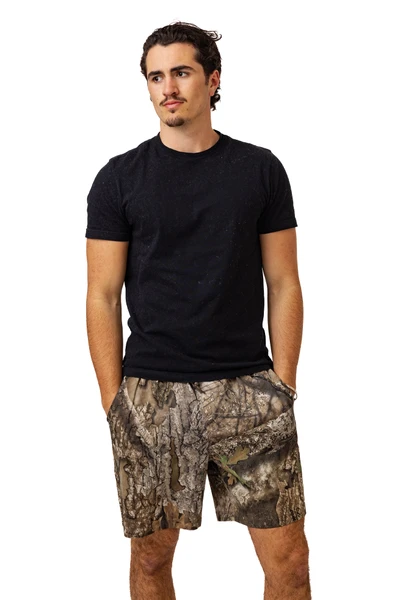 Full-body view of Realtree APX camo shorts styled with black tee.