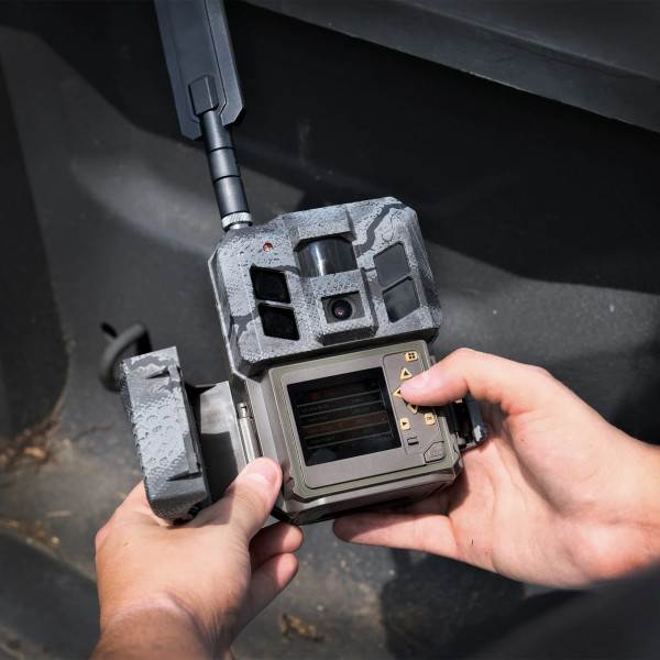 Close-up of the Spartan GoLive 3 trail camera with the display screen open, highlighting controls and onboard interface.