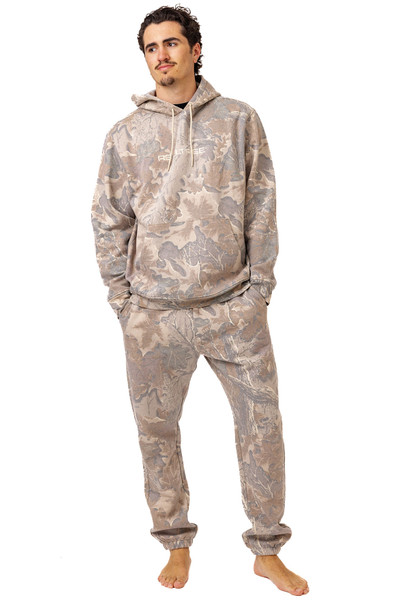 Man wearing Realtree Advantage Classic camo hoodie and matching sweatpants.