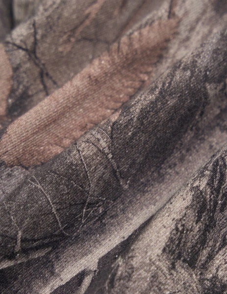 Close-up of Realtree EDGE camo denim fabric texture on Mugsy men's jeans.