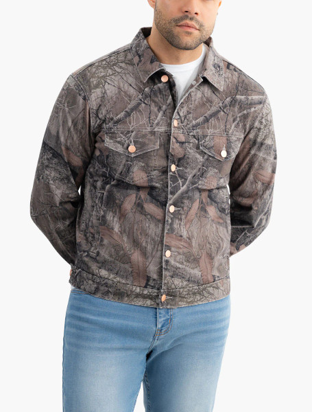 Mugsy men's camo denim jacket in Realtree EDGE worn by model, angled front view.