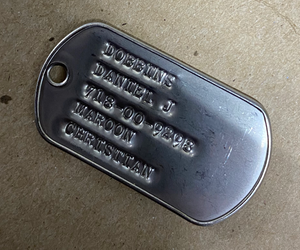 what is written on military dog tags