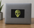 3 Inch x 5 Inch Green Alien Head Self-Adhesive Vinyl Decal on Black Background