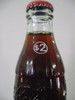 Botella Coca Cola Regular Con Valor  $ 2 En Cuello 1