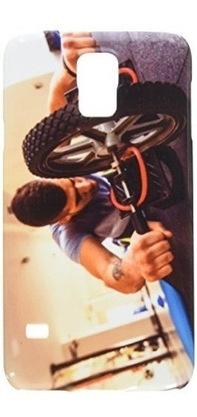 Man Working On His Abs With A Ab Roller At The Gym Cell 0