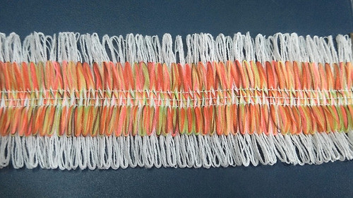 Fleco Doble Montado, Base Blanco, Centro Multicolor 1