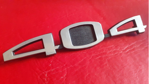Insignia Peugeot 404 (plastica) 0