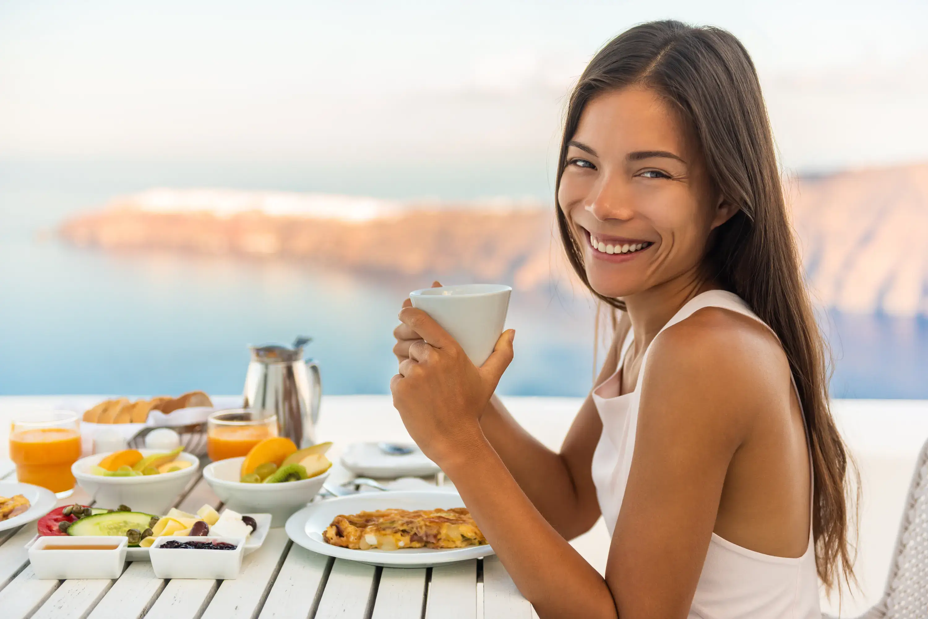Woman smiling at breakfast