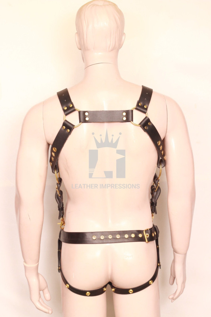 Black leather harness and jockstrap with golden hardware