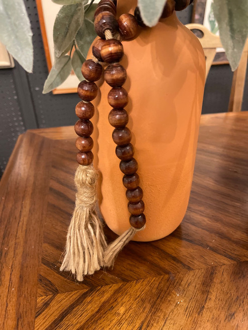 BROWN BEADS W/ TASSELS BROWN BEADS W/ TASSELS