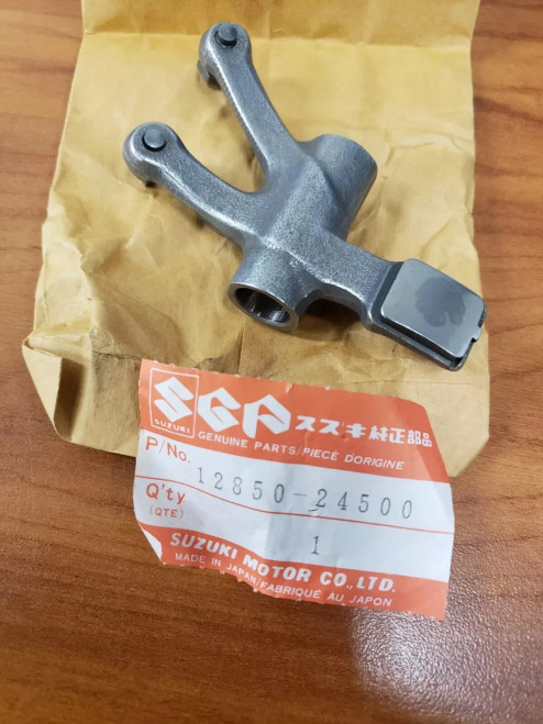 NOS SUZUKI OEM DR250 GN250 LT250E, VALVE ROCKER EXHAUST 12850-38201/ 12850-24500