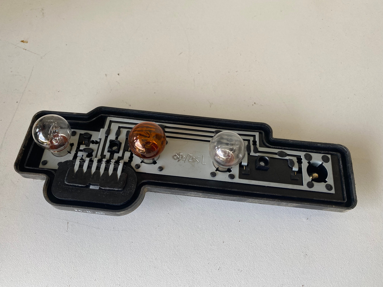 VW CADDY 20052010 USED LH TAIL LIGHT GLOBE HOLDER 2K0 945 257 A