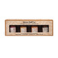 A gift box containing four 6 oz. amber glass jar candles from Slower Days Co., labeled Girls’ Night, Dessert First, Dancing Queen, and Espresso Martini.