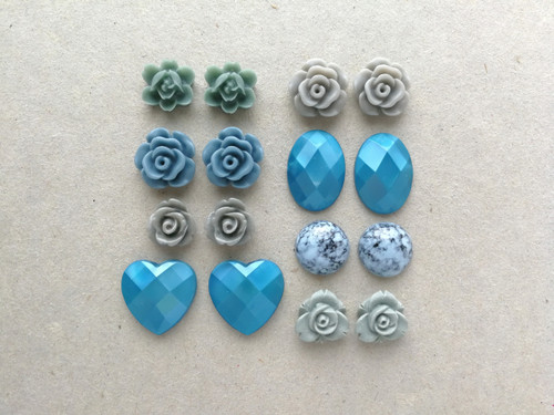 Resin cabochons in teal and gray.