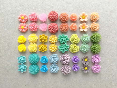 Resin flower cabochons in rainbow colours