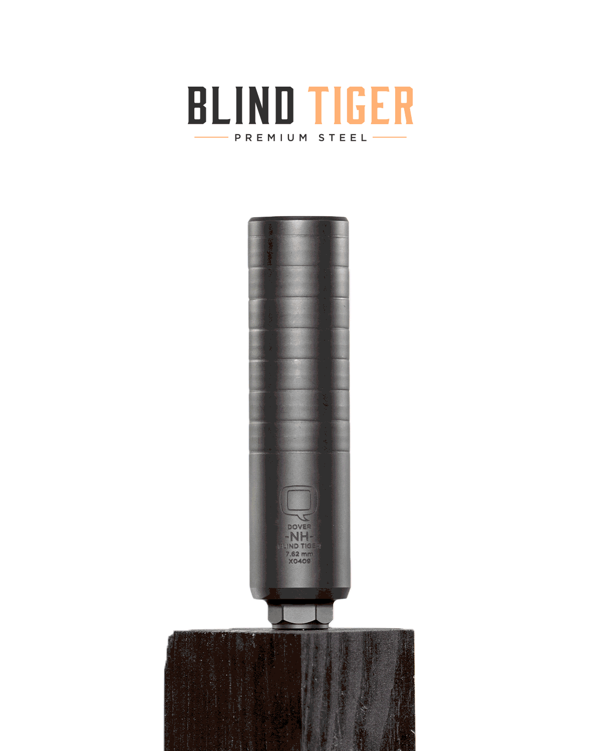 Animated GIF showcasing the Blind Tiger suppressor from Q. The suppressor rotates on a dark wood block, revealing its sleek, all-steel construction and engraved markings. The logo “BLIND TIGER – PREMIUM STEEL” appears at the top in black and orange text.
