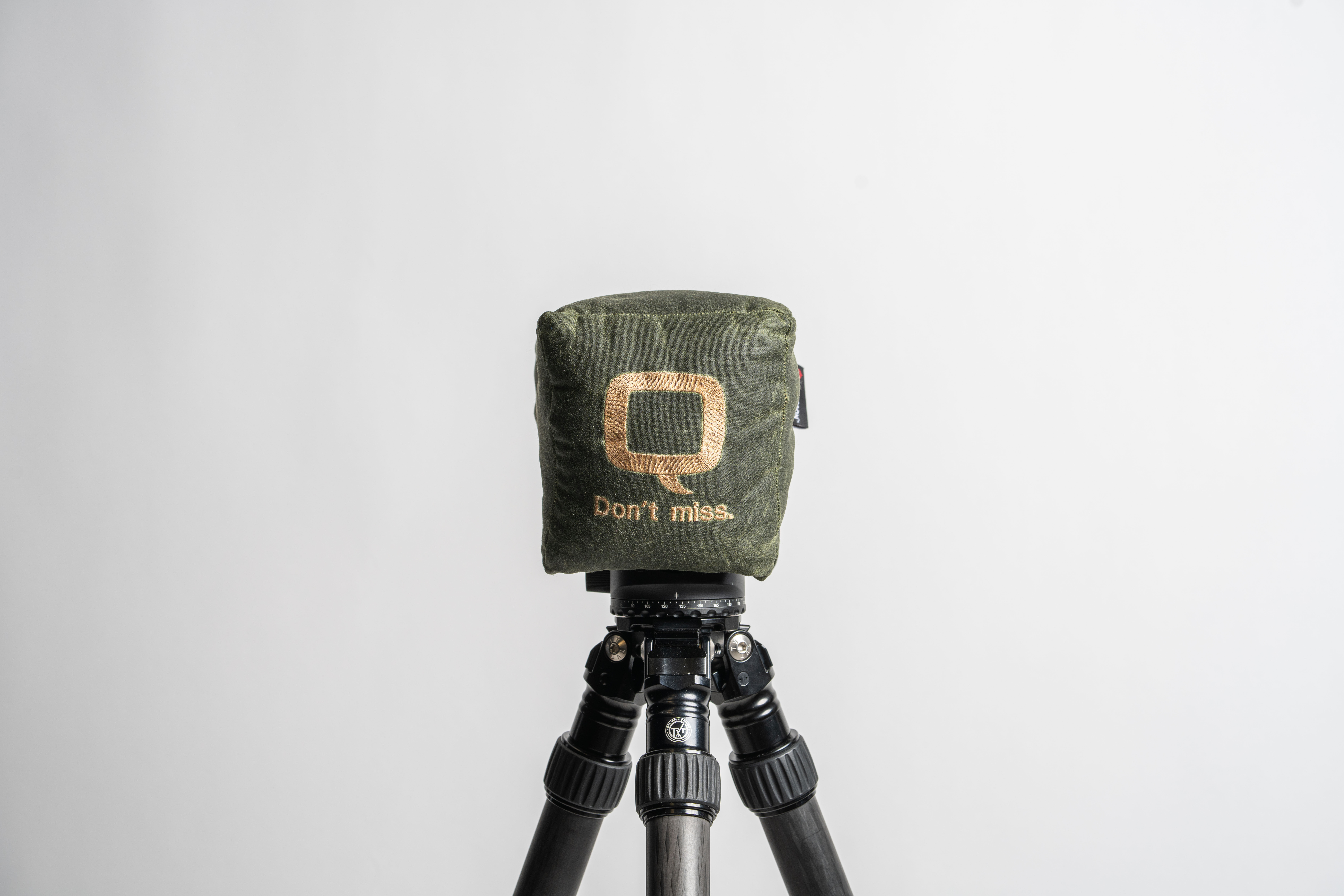 Green Game Changer shooting bag on tripod with text that reads “Don’t Miss”
