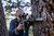 A hunter holding a rifle with the Pantera 256 Q Thermal Scope, highlighting the optic's lightweight, classic rifle scope design.