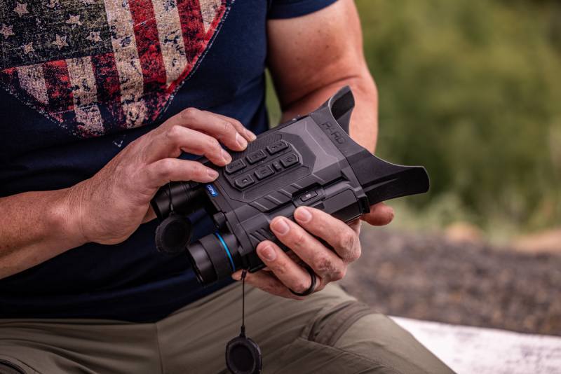 Man holding a  Harrier Thermal Imaging Binocular.