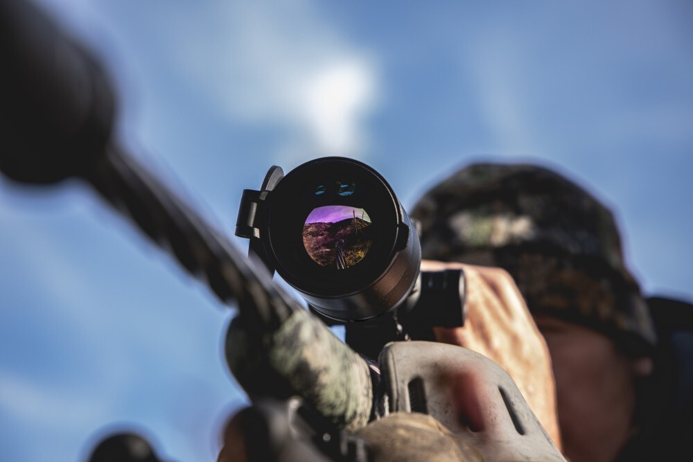 Hunter looking through Pantera eX 640 thermal scope.