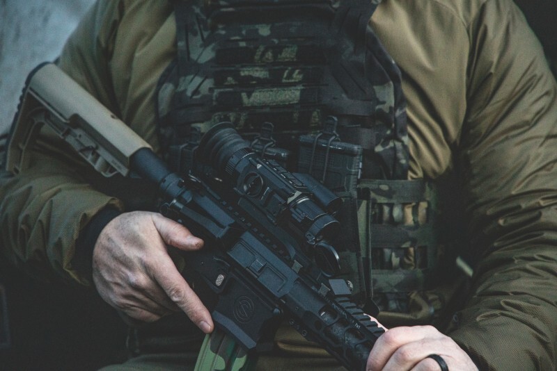 Rear angle of PARD thermal optic showing eyepiece, control buttons, and durable housing.