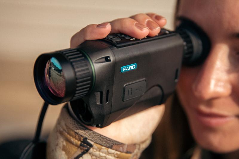 Hunter using a NV009 Night Vision Monocular.