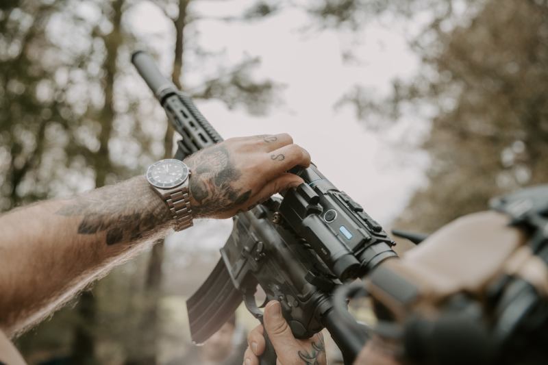 Hunter adjusting the Pard Ocelot 640-Zoom Thermal Imaging Scope in the field.