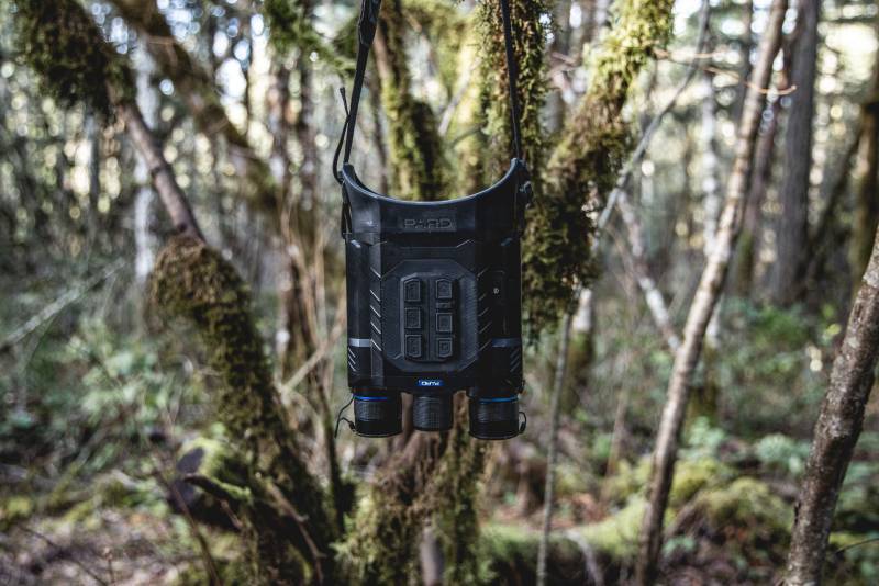 Top-down photo of PARD thermal multi-spectral binoculars showing lens housing and side control buttons.