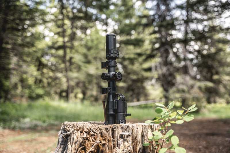 TD32/62(LRF) Multi-spectral Riflescope resting on a stump.